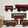 20世纪30年代艾夫斯卷起列车原盒设置＃1590。Painted sheet metal 0-4-0 steam locomotive with Ives R.R.  Lines tin-litho tender and three Pullman cars.  Estimate $300-$600