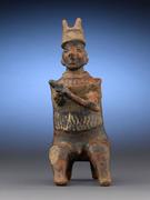 这一令人难以置信的纳亚里特战士形象代表了一位备受尊敬的酋长，角、杖和坐姿都表明了这一点。